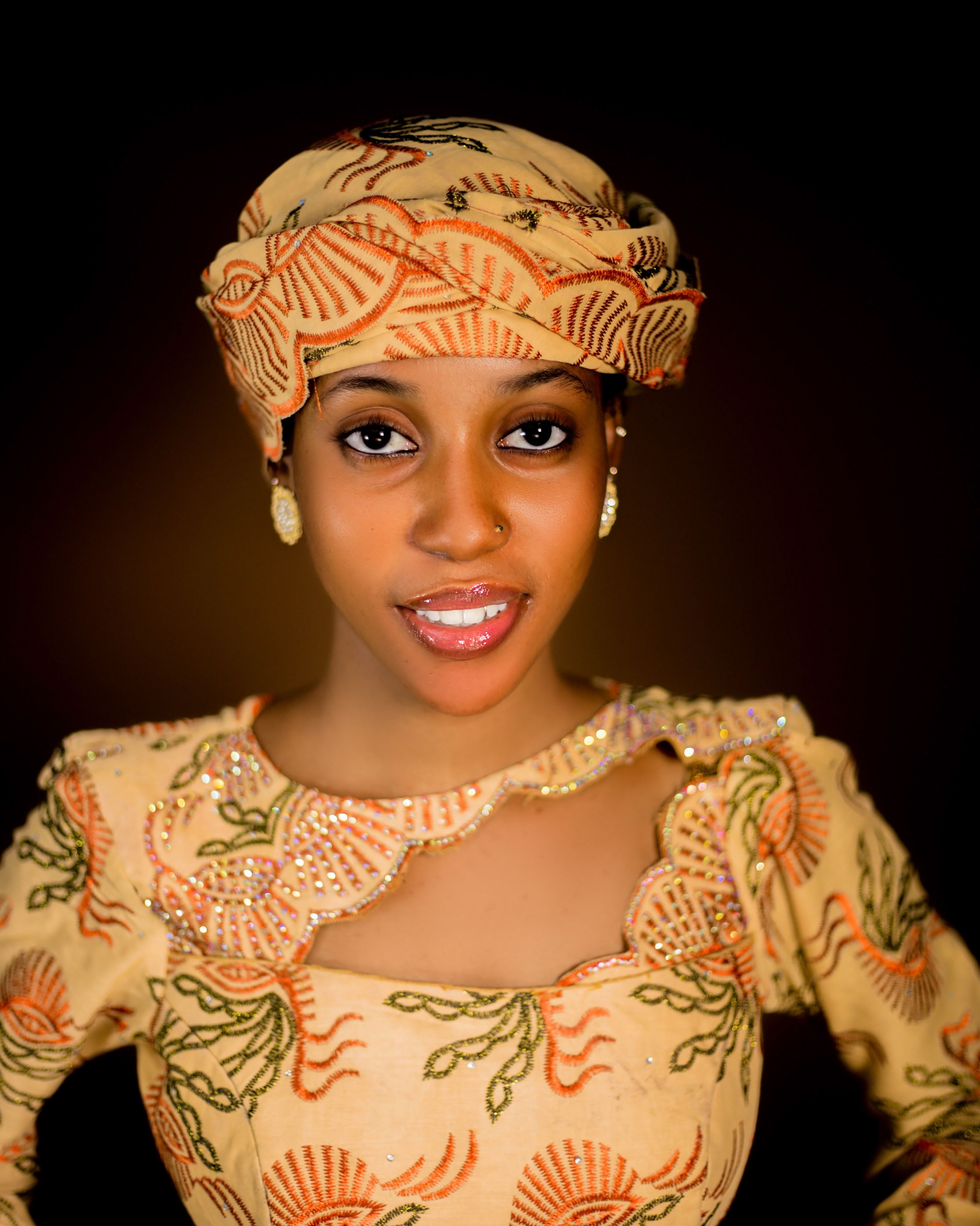 Elegant Traditional Attire Portrait with Warm Lighting · Free Stock Photo
