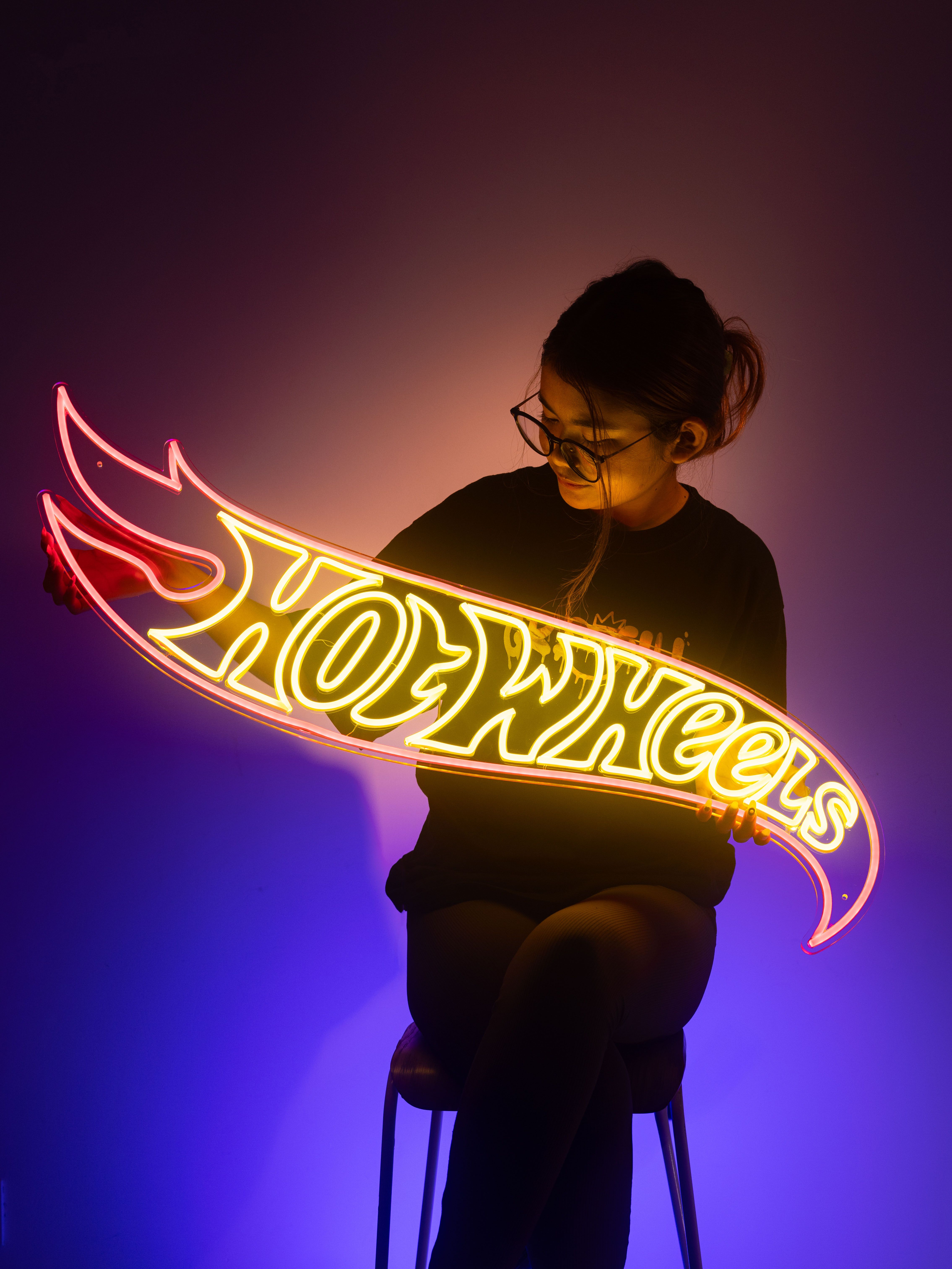 Girl with Hotwheel Neo sign by RC Cambodia