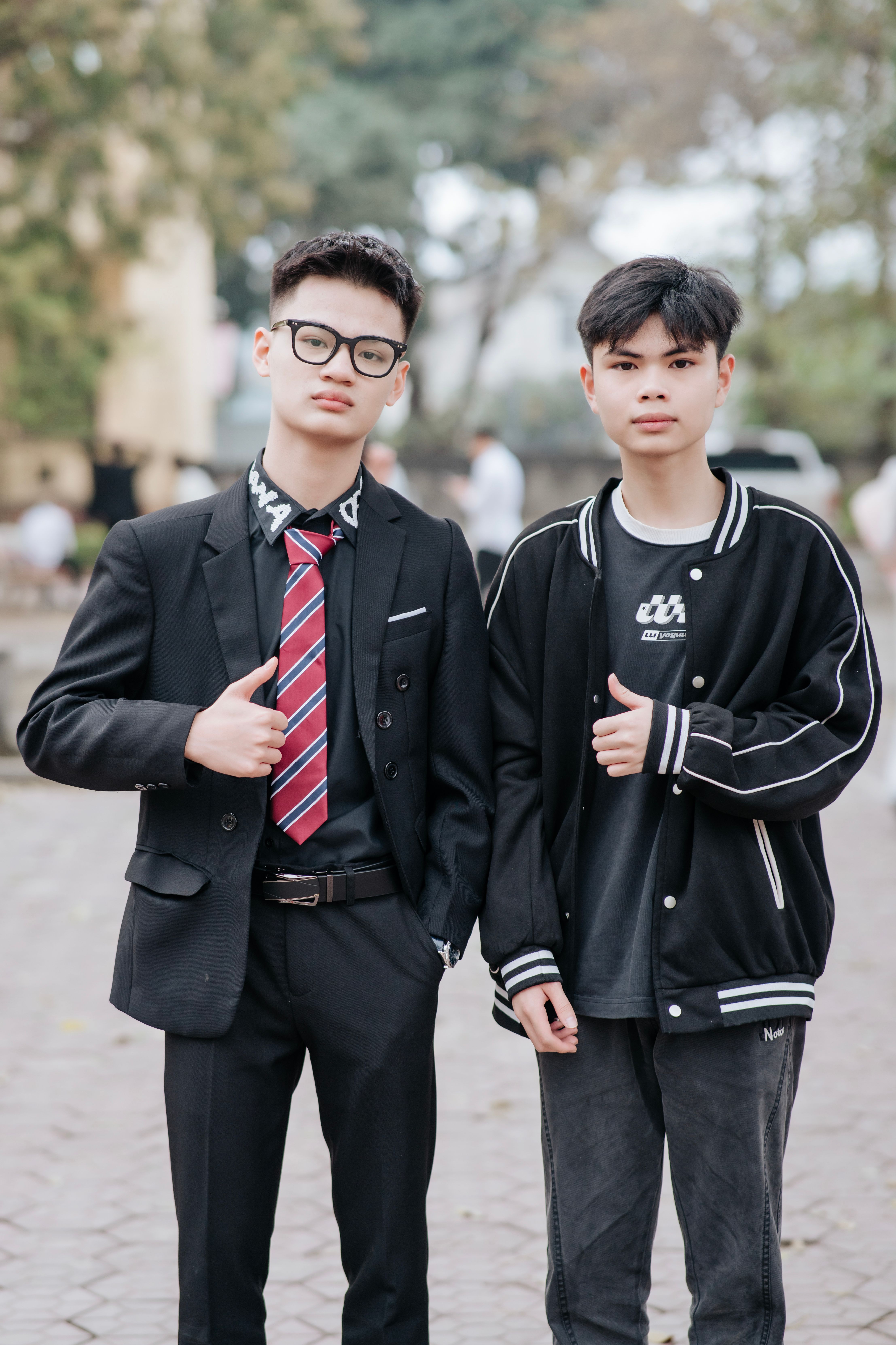 Two Young Men in Casual and Formal Outfits · Free Stock Photo