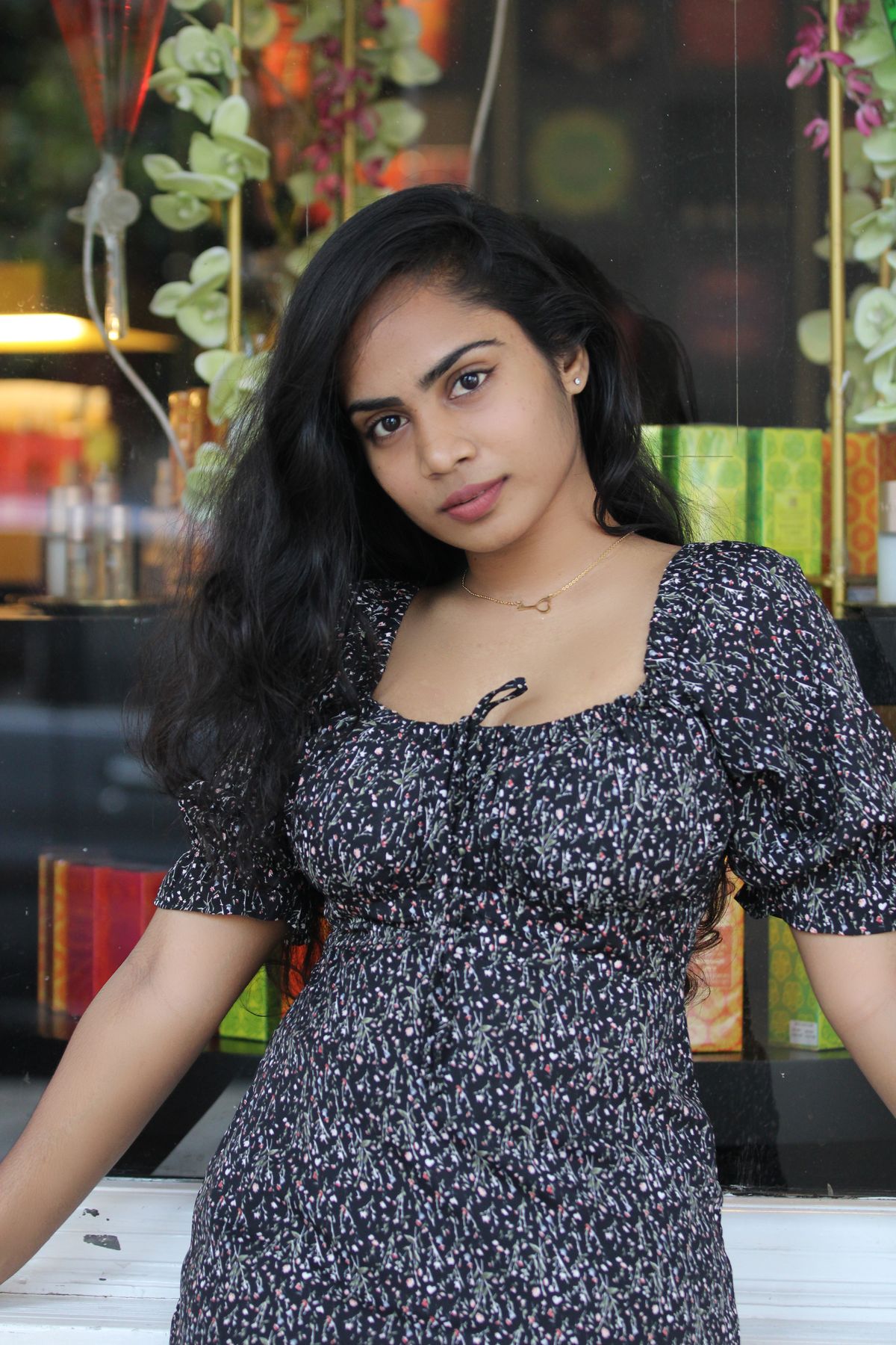 Portrait of a Woman with Long Black Hair in a Floral Dress · Free Stock ...