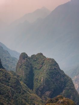 Stunning misty mountain view showcasing lush greenery in Vietnam's hills.