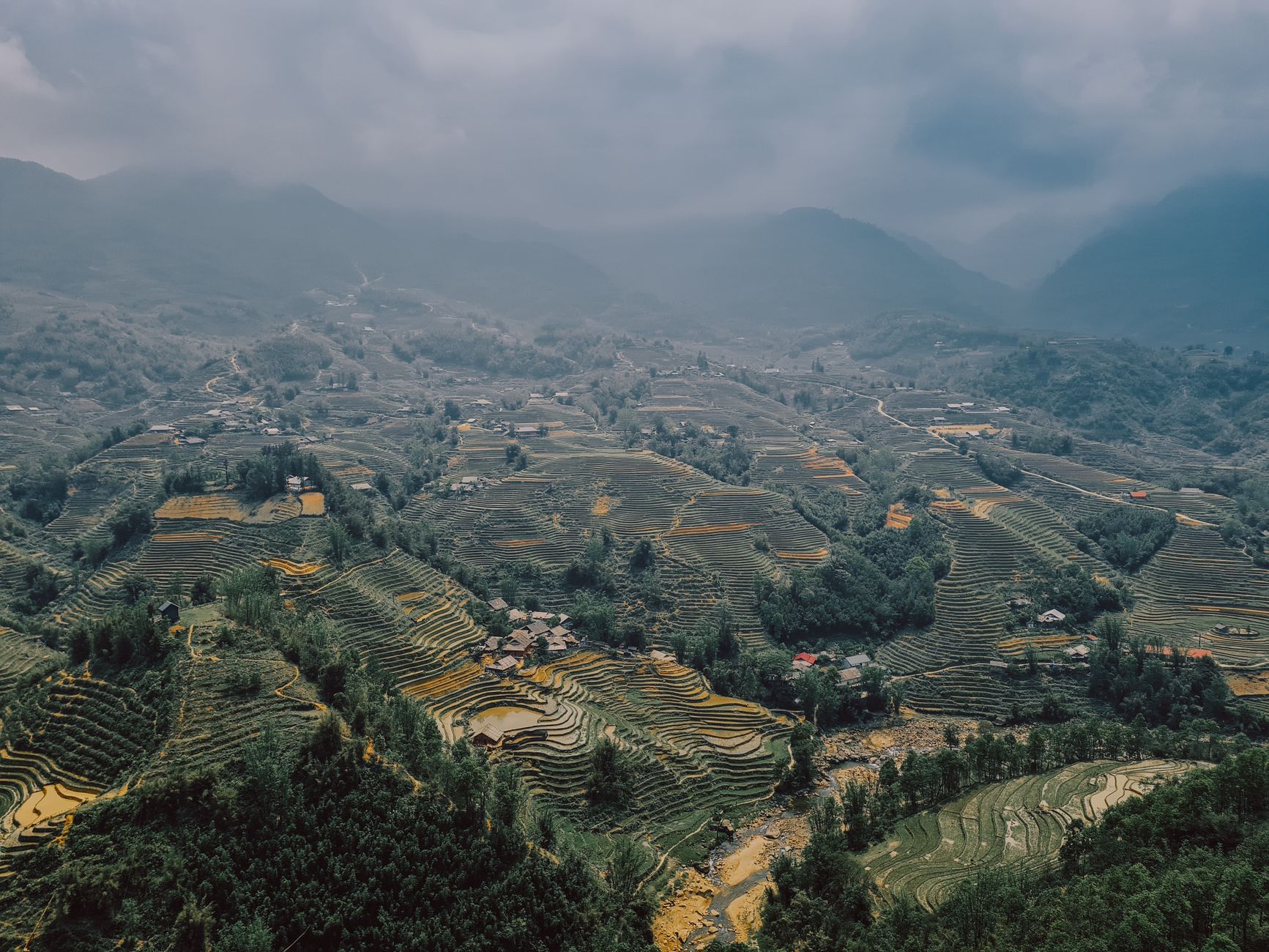 Stunning aerial view of terraced rice fields in Vietnam, showcasing natural beauty and agricultural creativity.