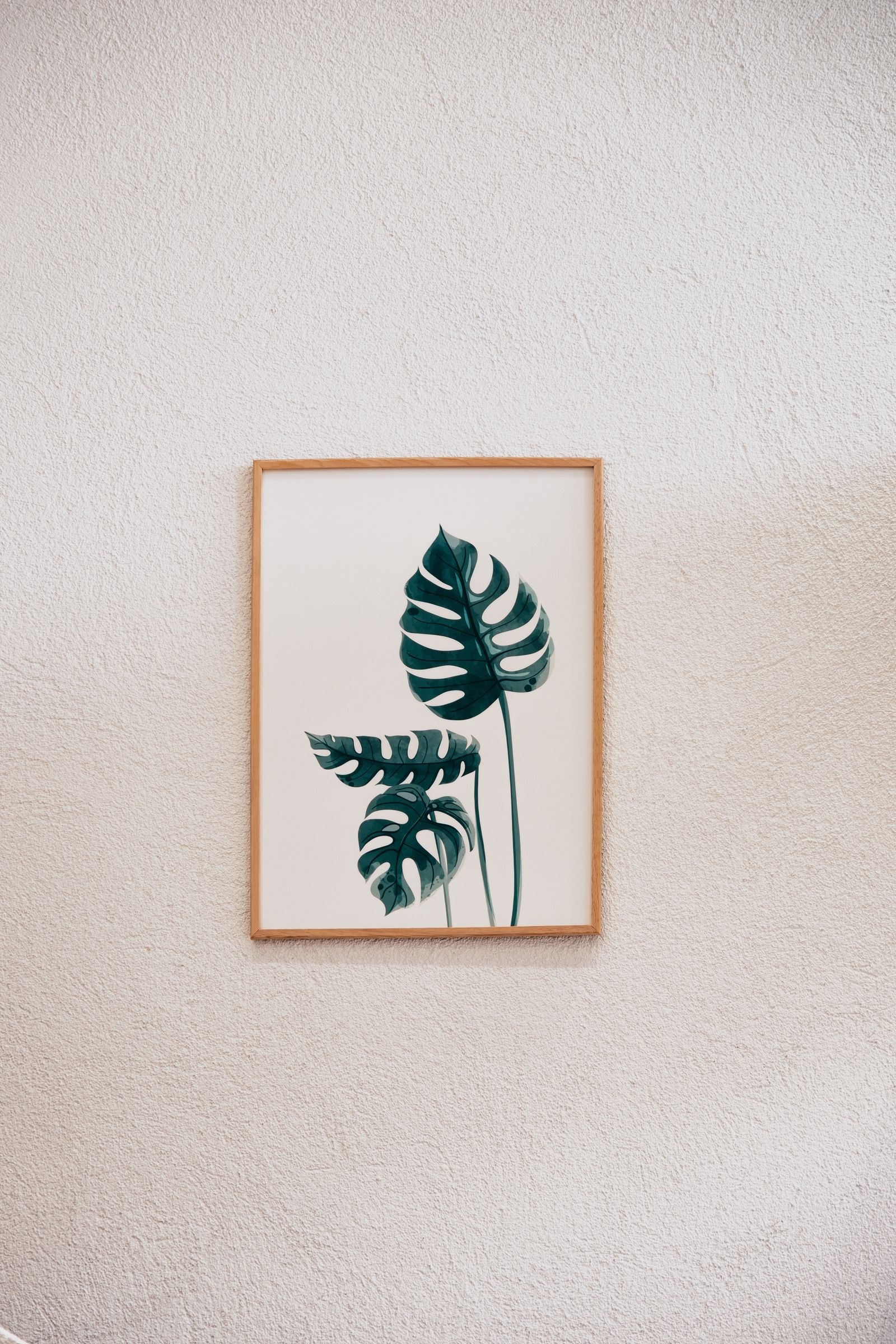 free-photo-of-framed-monstera-leaf-artwork-on-textured-wall.jpeg?w=1600
