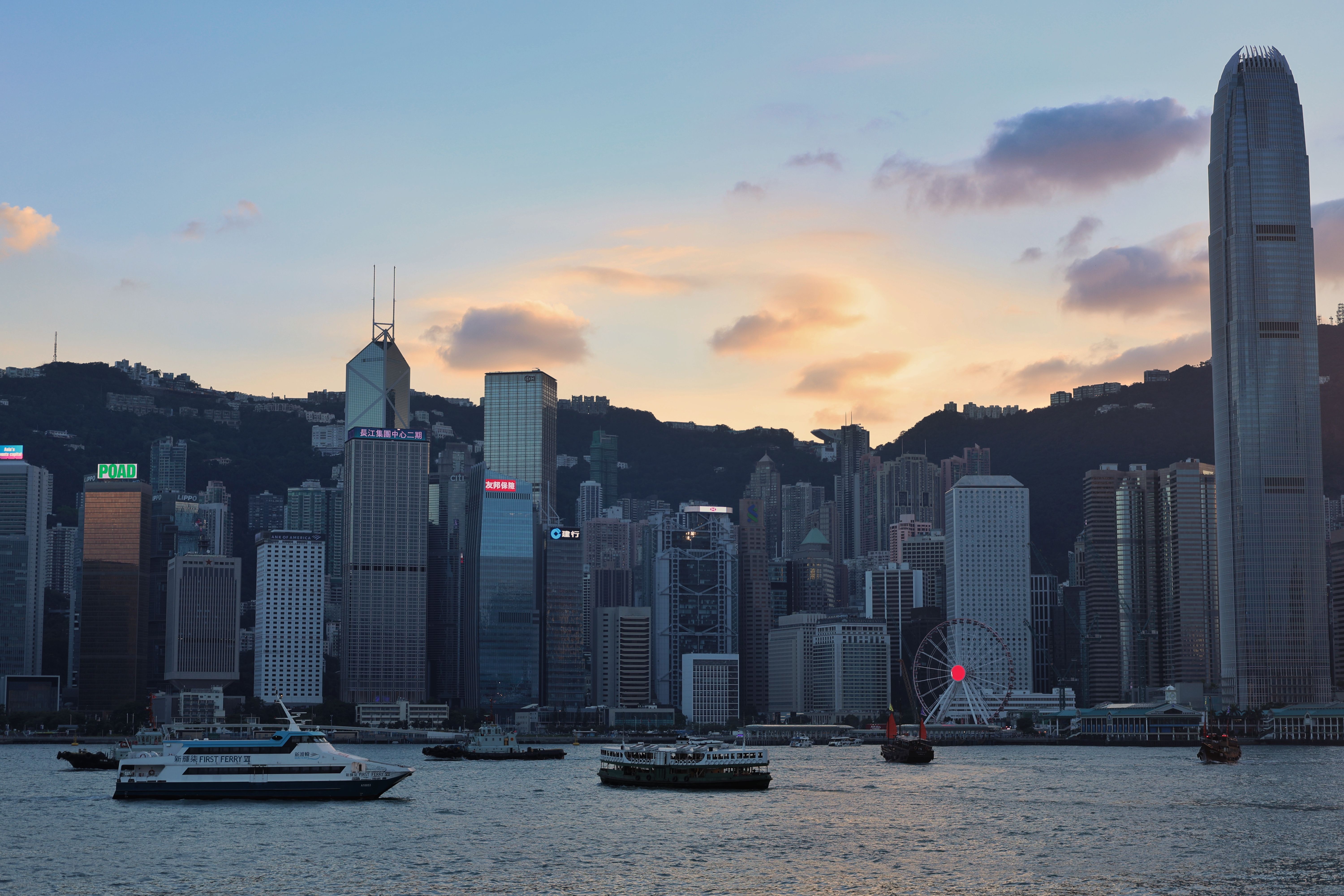 Hong Kong Skyline During Sunset with Ferries · Free Stock Photo