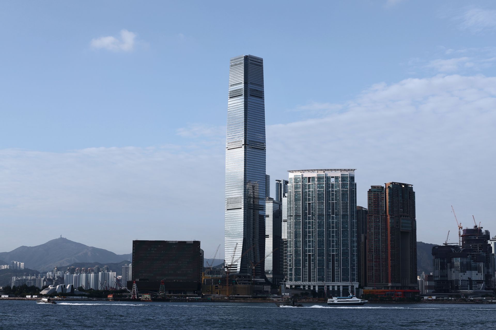 Stunning view of Hong Kong's skyline featuring the iconic International Commerce Centre skyscraper.