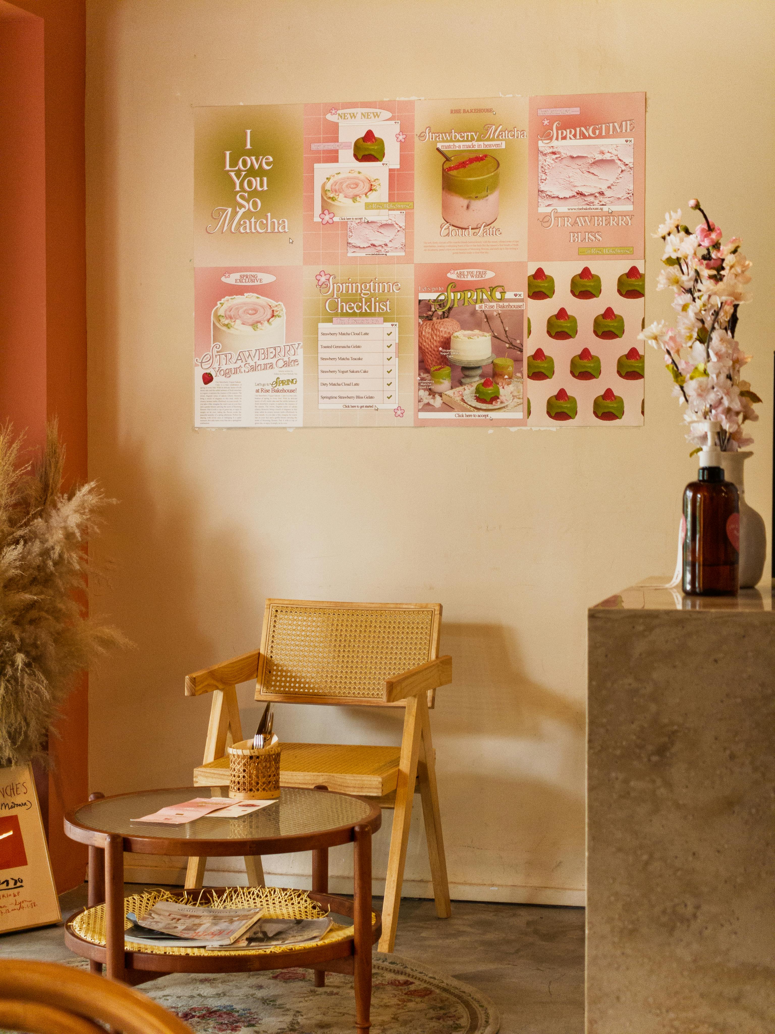 Elegant cafe corner with matcha-themed posters, bamboo chair, and floral decor.