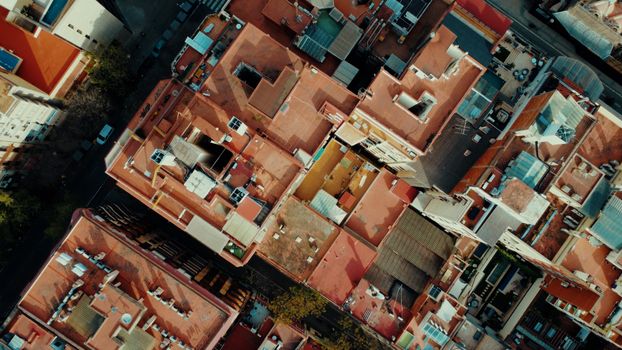 A vibrant aerial view showcasing the colorful rooftops of buildings in Barcelona, Spain.