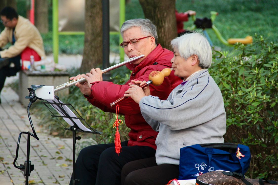 Senior Couples Playing Flute in a Park · Free Stock Photo
