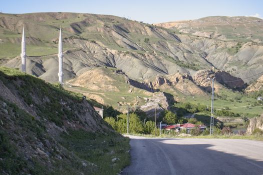 Explore the rolling hills and striking minarets of Palu, Elazığ, Türkiye in this captivating landscape photograph.