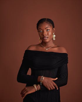 Sophisticated portrait of a woman wearing elegant jewelry against a warm background.
