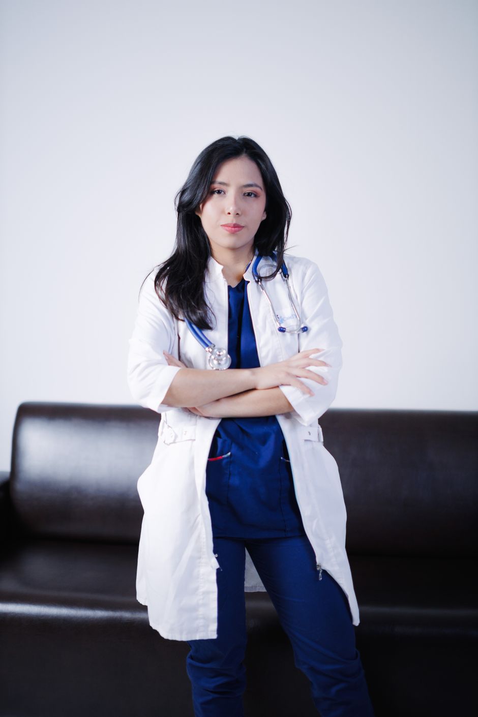 A confident female physician in a medical setting