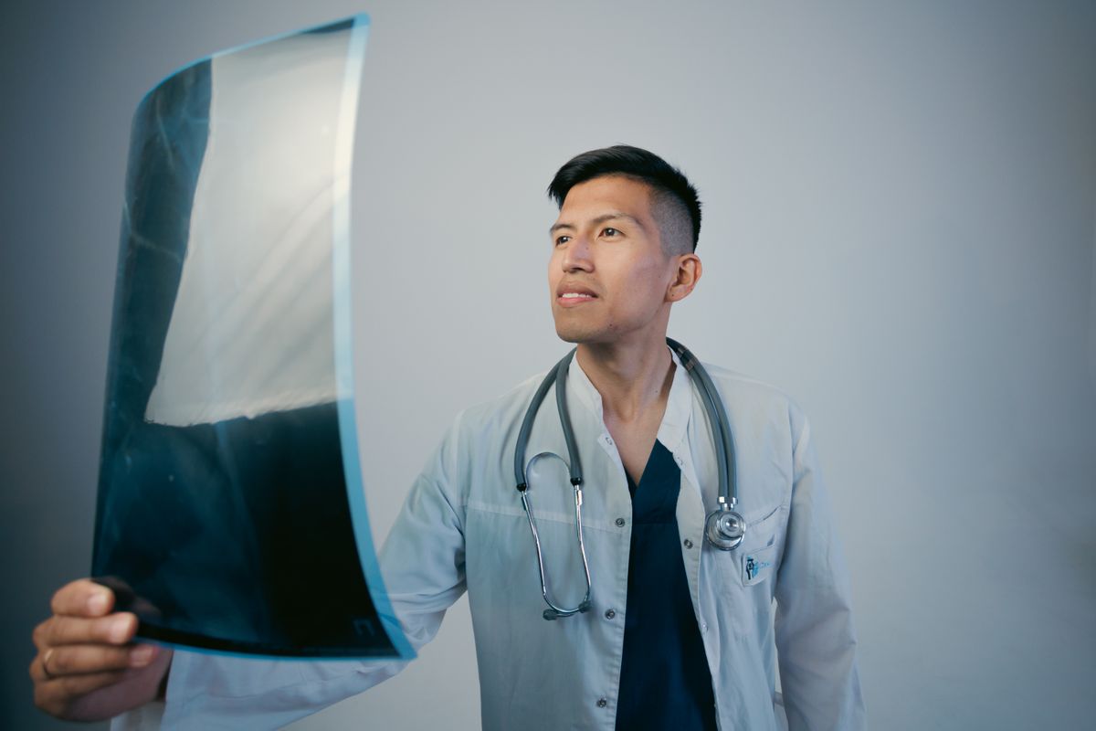A doctor studying an X-ray