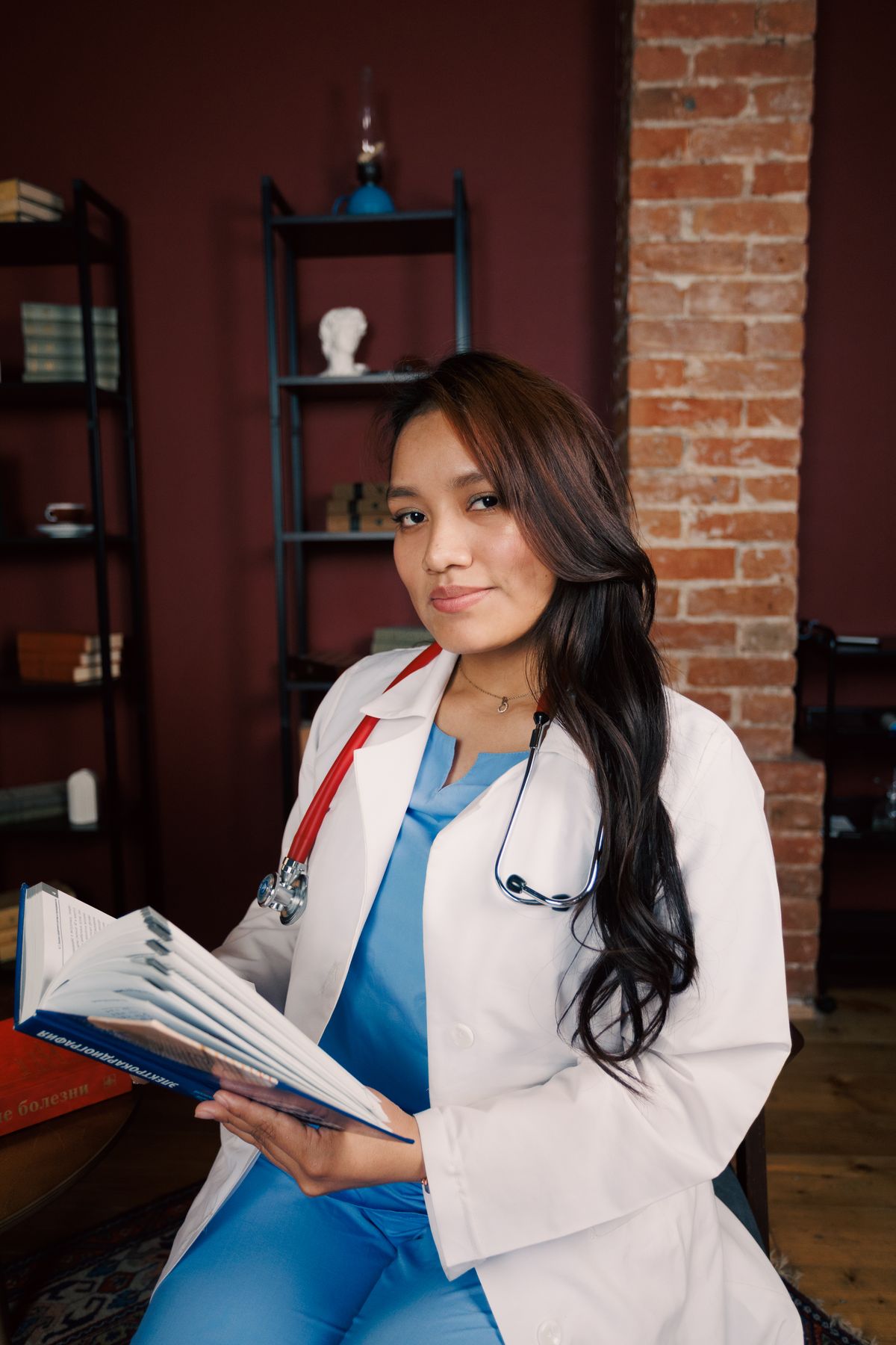 A doctor reading a medical book in a quiet study