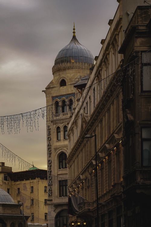 Free View of Istanbul's Legacy Ottoman Hotel and historic buildings at sunset. Captivating architecture. Stock Photo