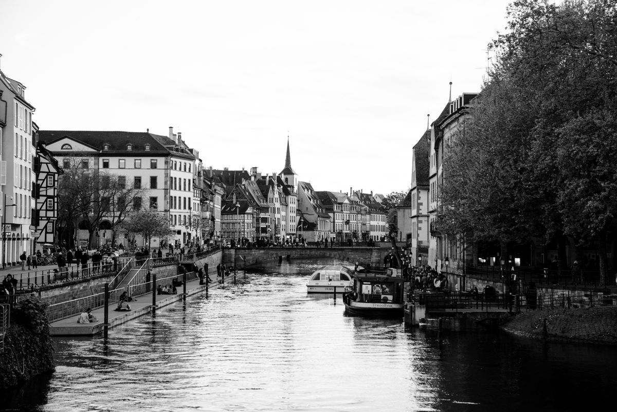 Half-timbered houses reflected in a quiet canal