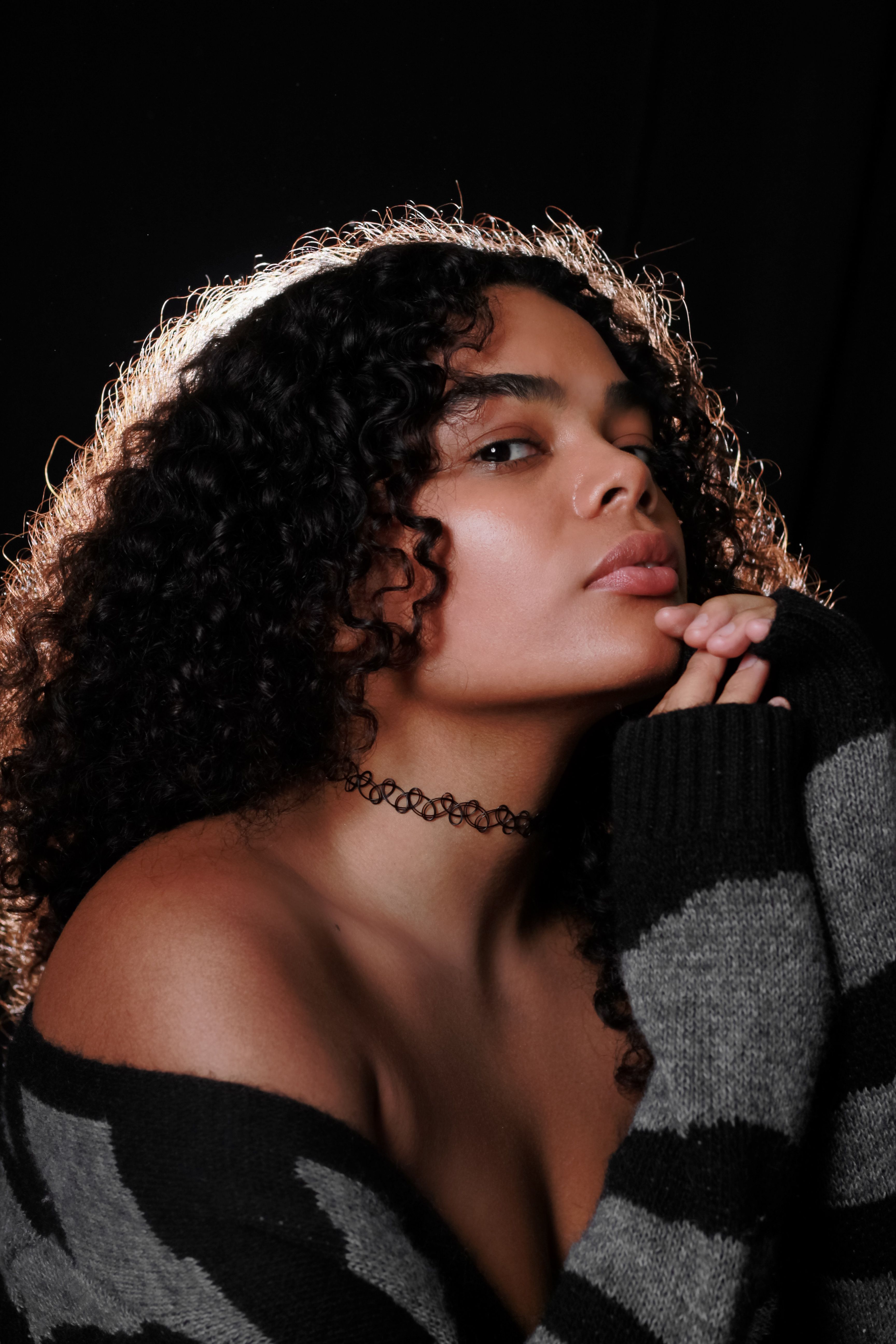 Portrait of Woman with Curly Hair in Studio · Free Stock Photo