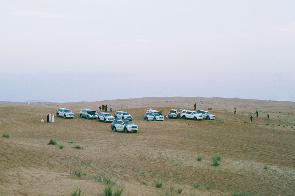 Tourists enjoying a desert safari and dune bashing in the Qatari desert