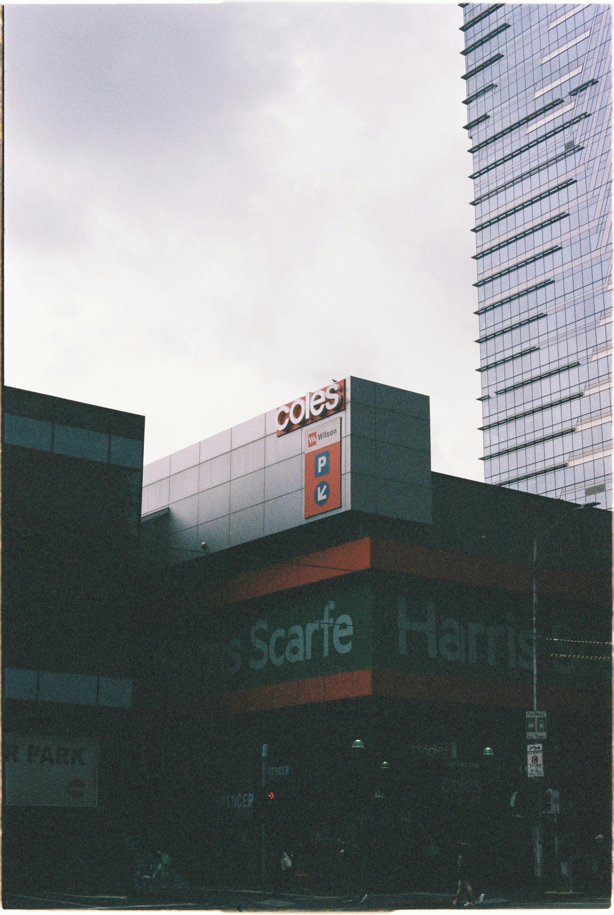 Urban scene showcasing a shopping center in Melbourne with high-rise architecture.
