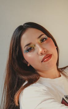 Vibrant portrait of a young woman with colorful eye makeup in San Luis Potosí, Mexico.