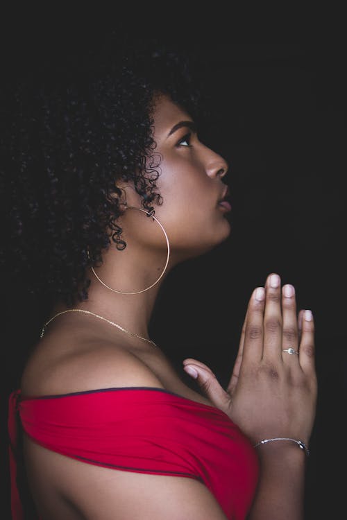 Woman in Red Top Praying