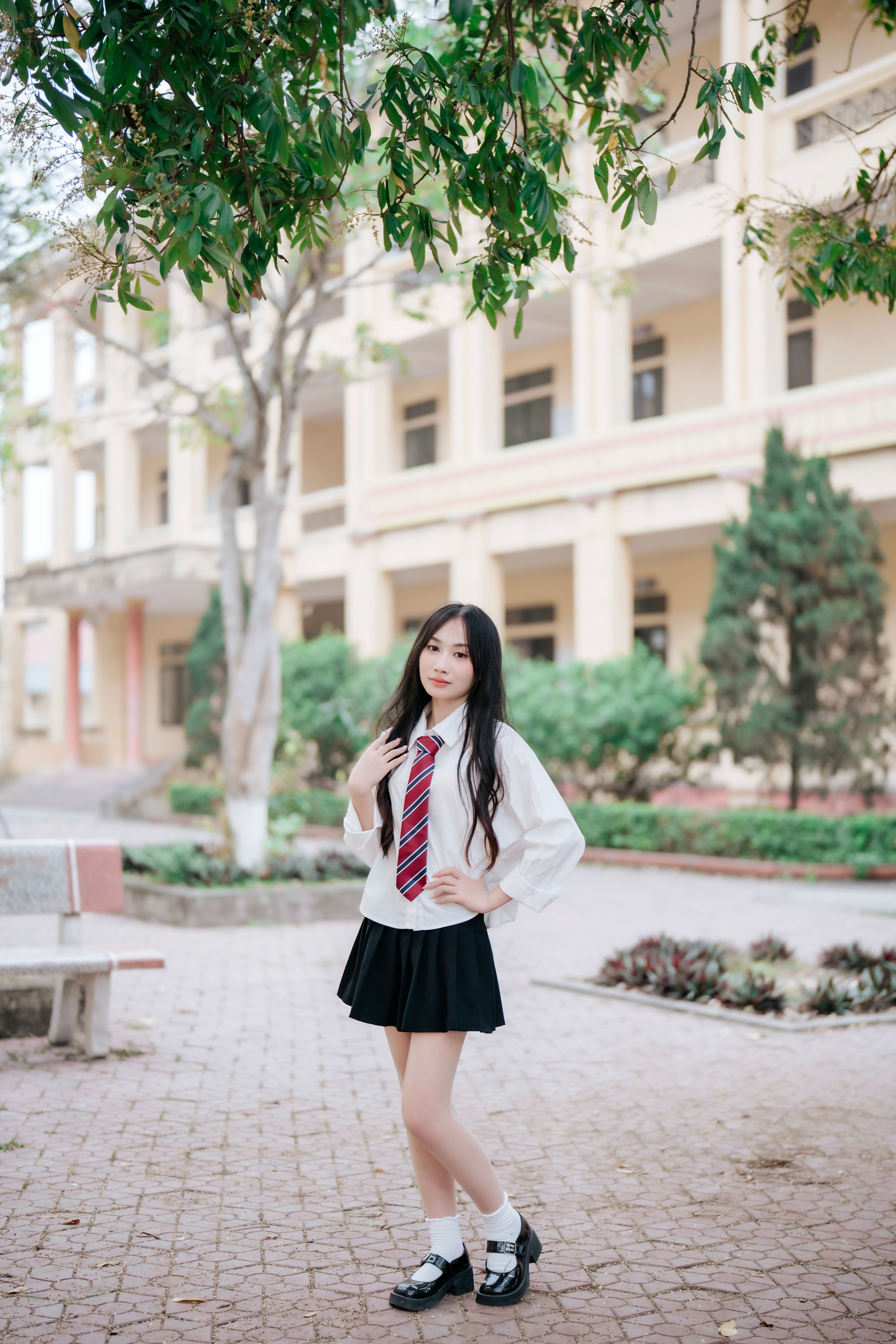 Teenage Girl Posing in School Uniform Outdoors · Free Stock Photo