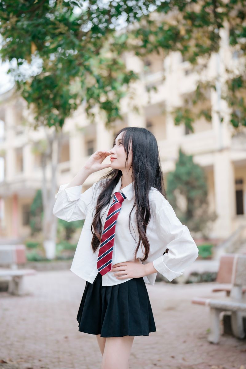 Teenage Girl Posing in School Uniform Outdoors · Free Stock Photo