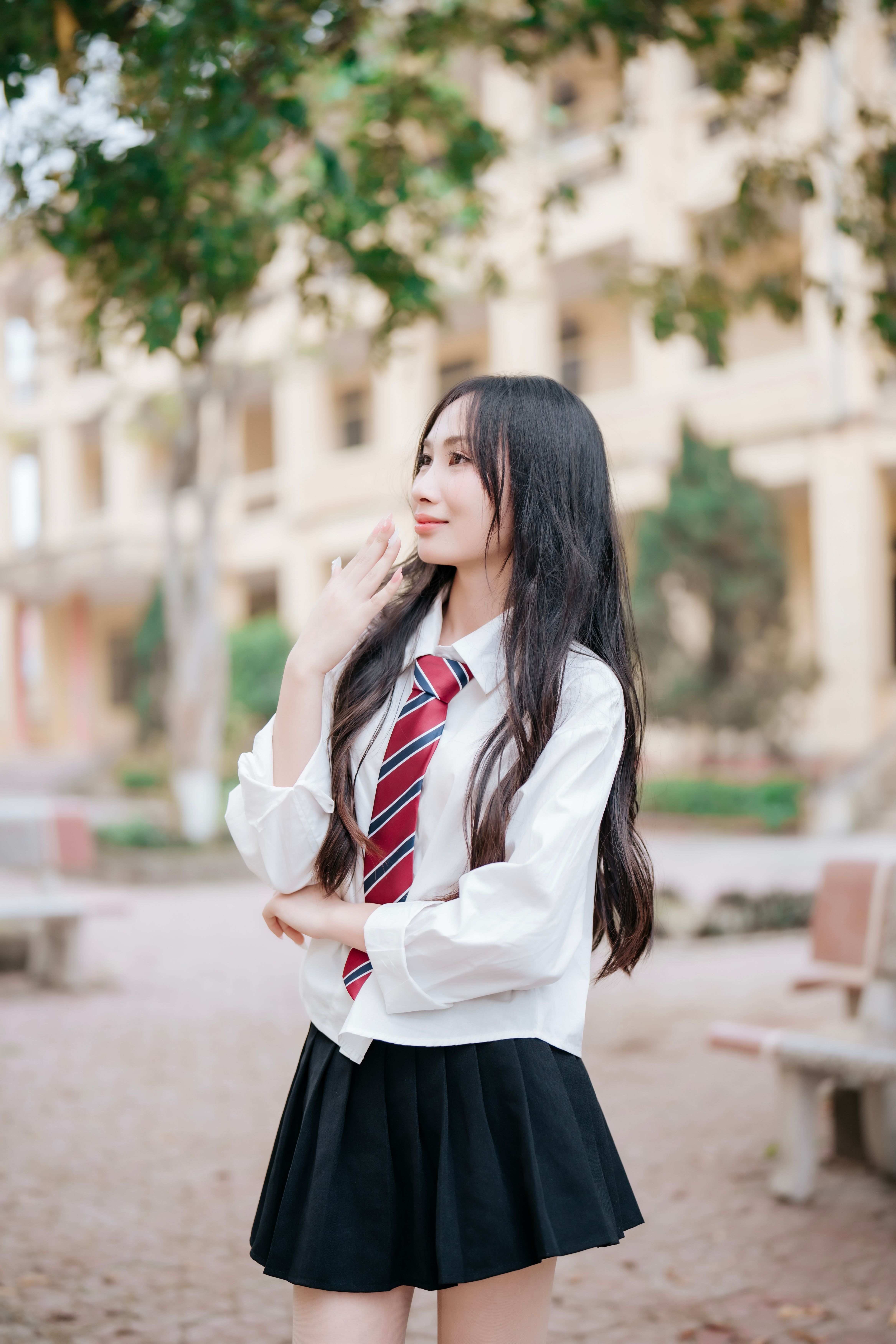 Young woman in school uniform outdoors · Free Stock Photo