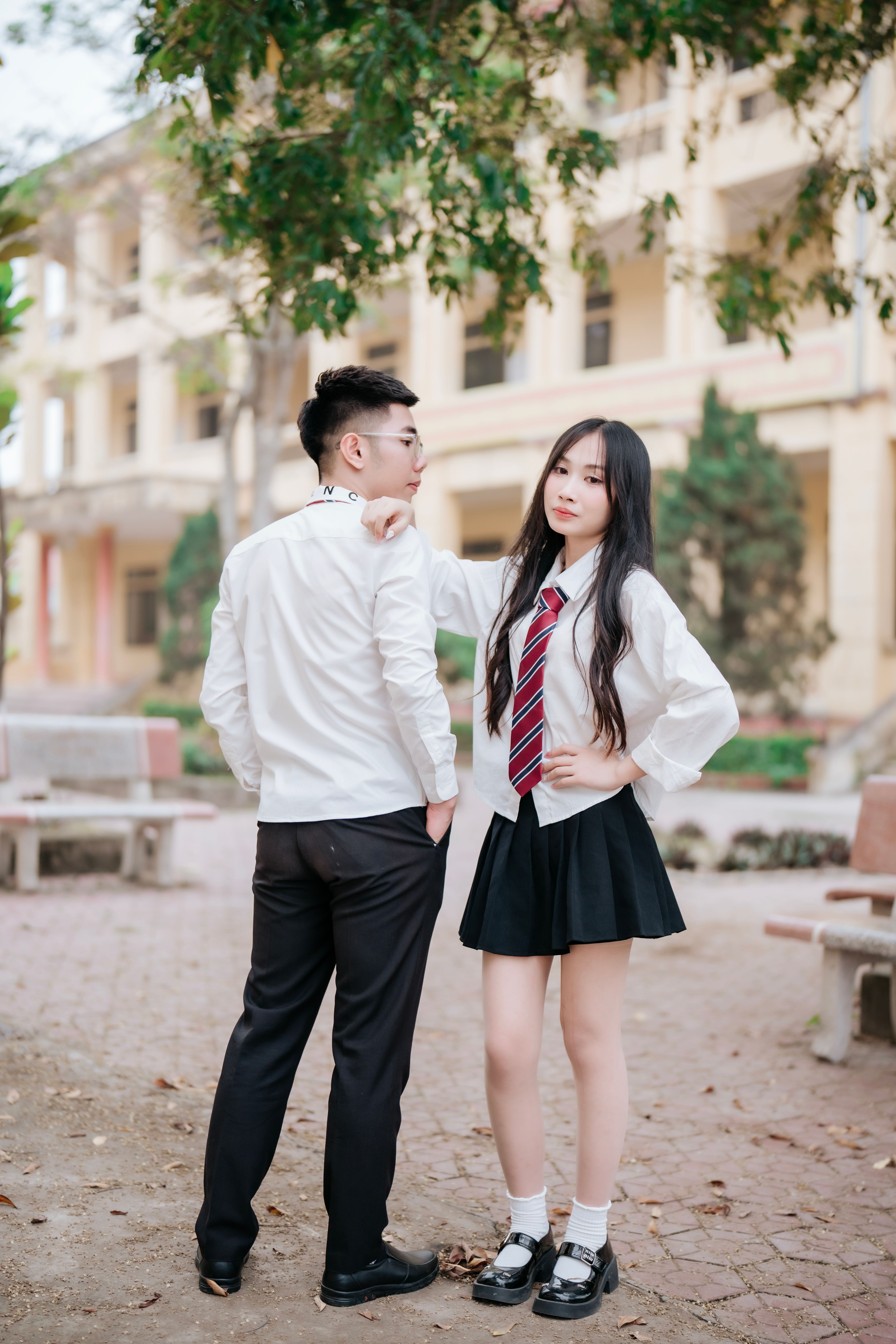 Young Students Posing in School Uniform Outdoors · Free Stock Photo