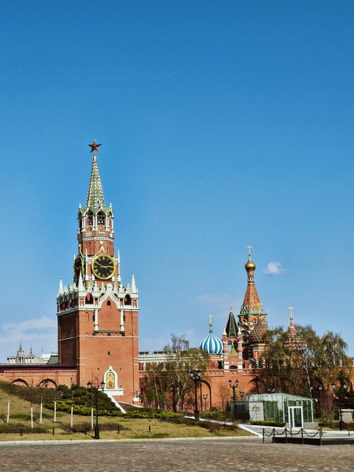 Free Stunning view of the Kremlin's Spasskaya Tower and Saint Basil's Cathedral in Moscow. Stock Photo