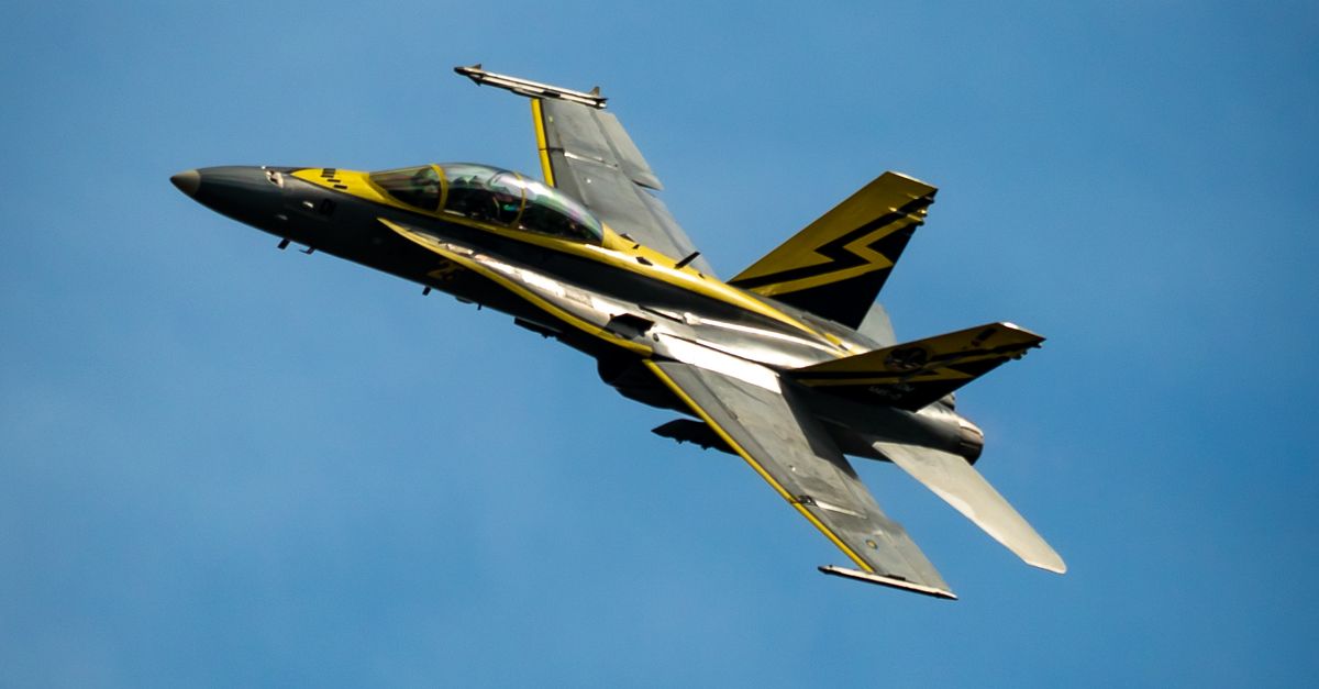 Dynamic Jet Fighter in Blue Sky Mid-Flight · Free Stock Photo