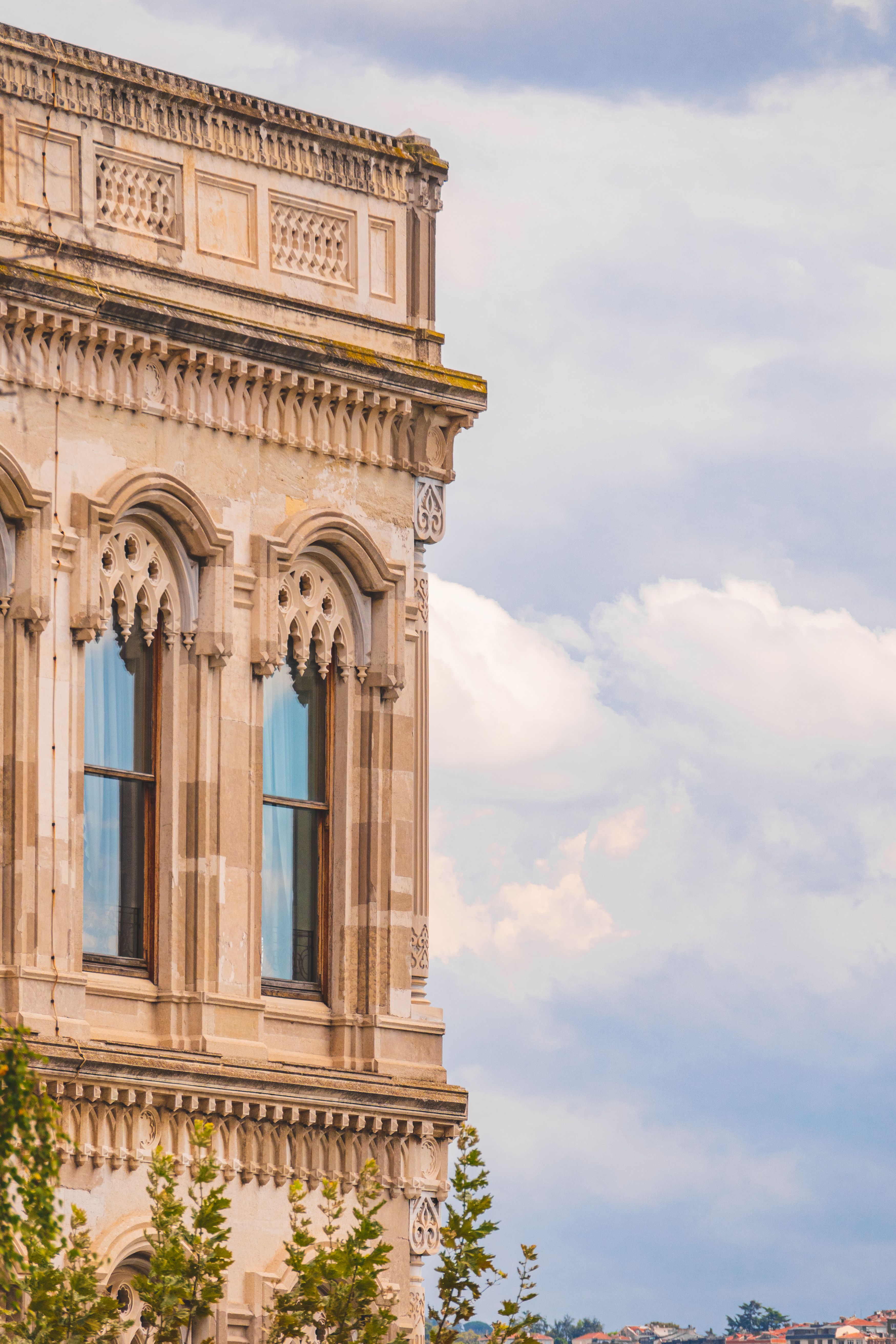 Elegant Historical Building Facade Against Cloudy Sky · Free Stock Photo
