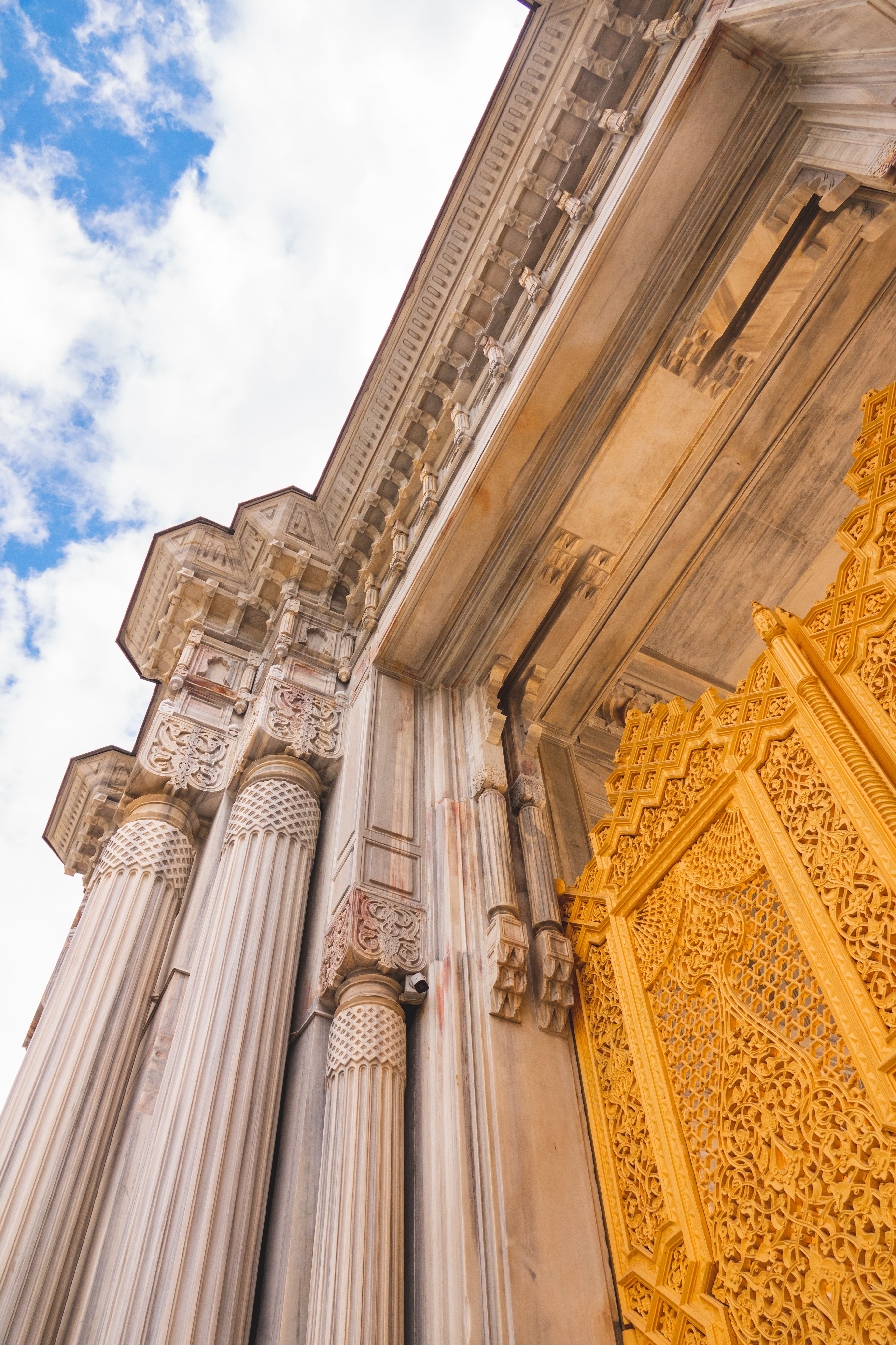 Ornate Historical Facade with Golden Gate · Free Stock Photo