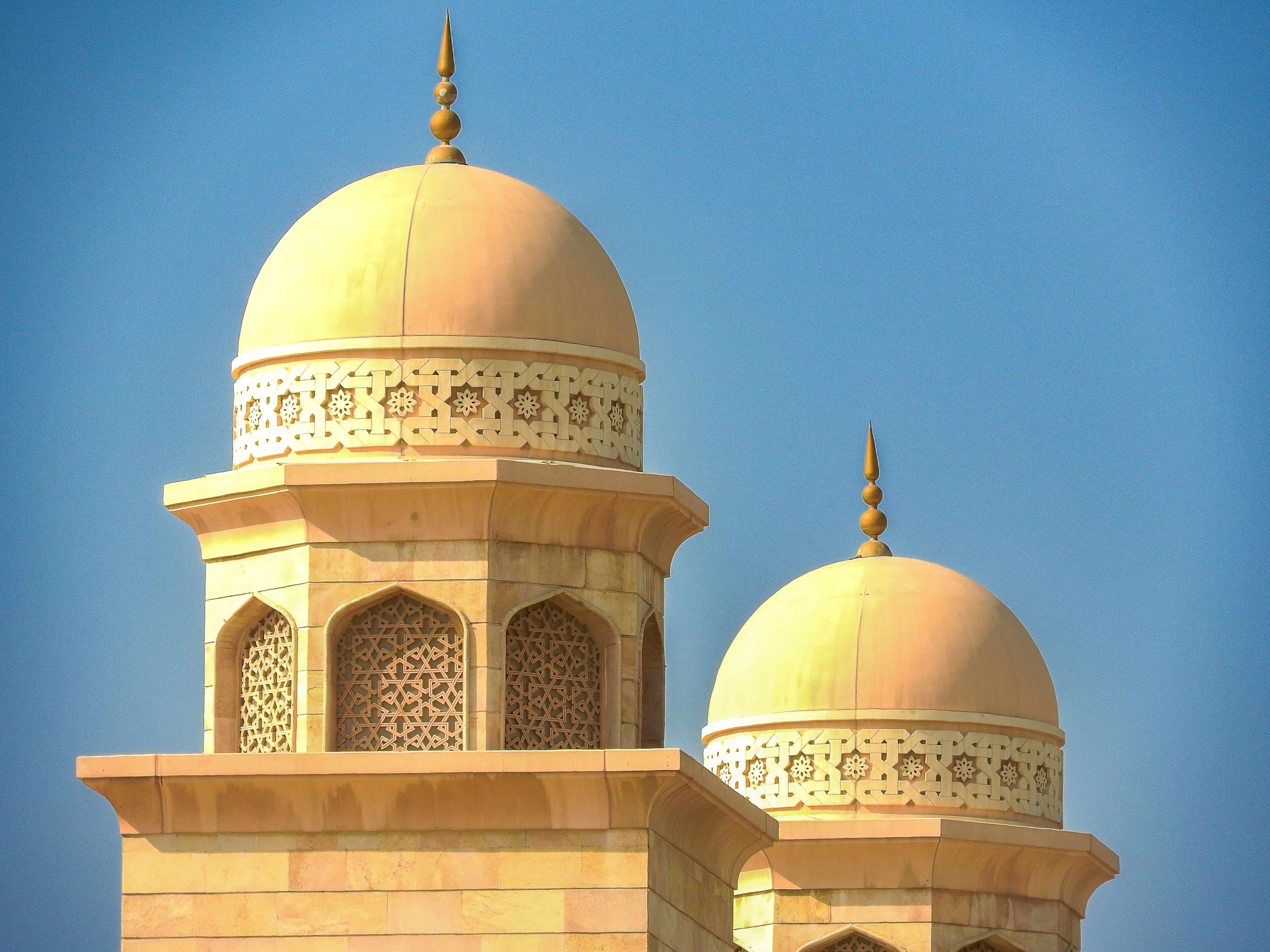 Majestic Mosque Domes Against Clear Blue Sky · Free Stock Photo