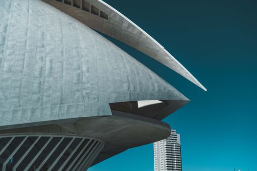 Explore the striking modern architecture of Palau de les Arts in Valencia, Spain, under a clear blue sky.