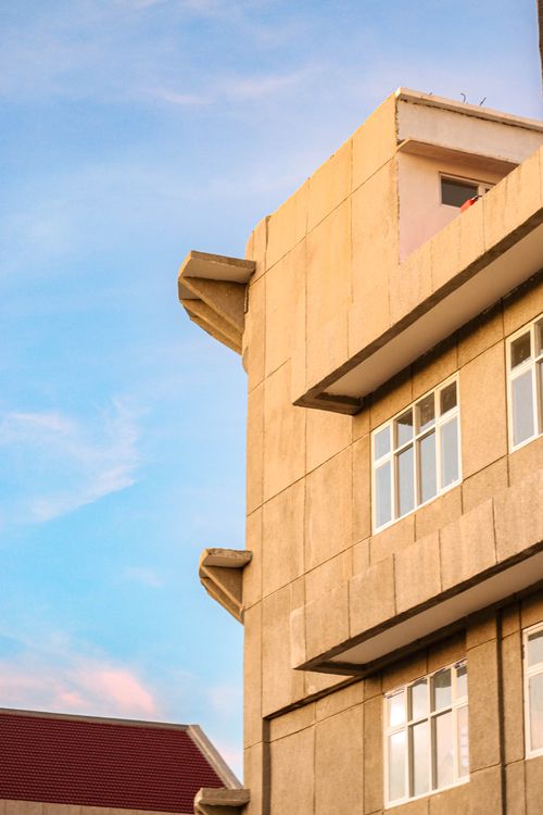 Free Exterior of a vintage building with a sunny sky, highlighting urban nature. Stock Photo