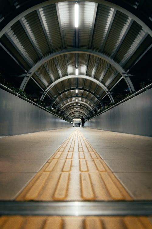 Free Stylish modern subway tunnel in Vietnam at night with a dramatic perspective view. Stock Photo