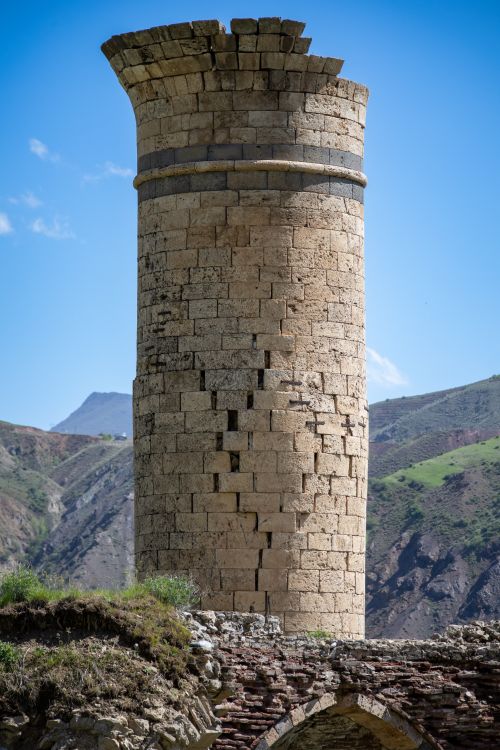 Free A historic stone tower set against the scenic mountainous landscape of Palu, Türkiye. Stock Photo