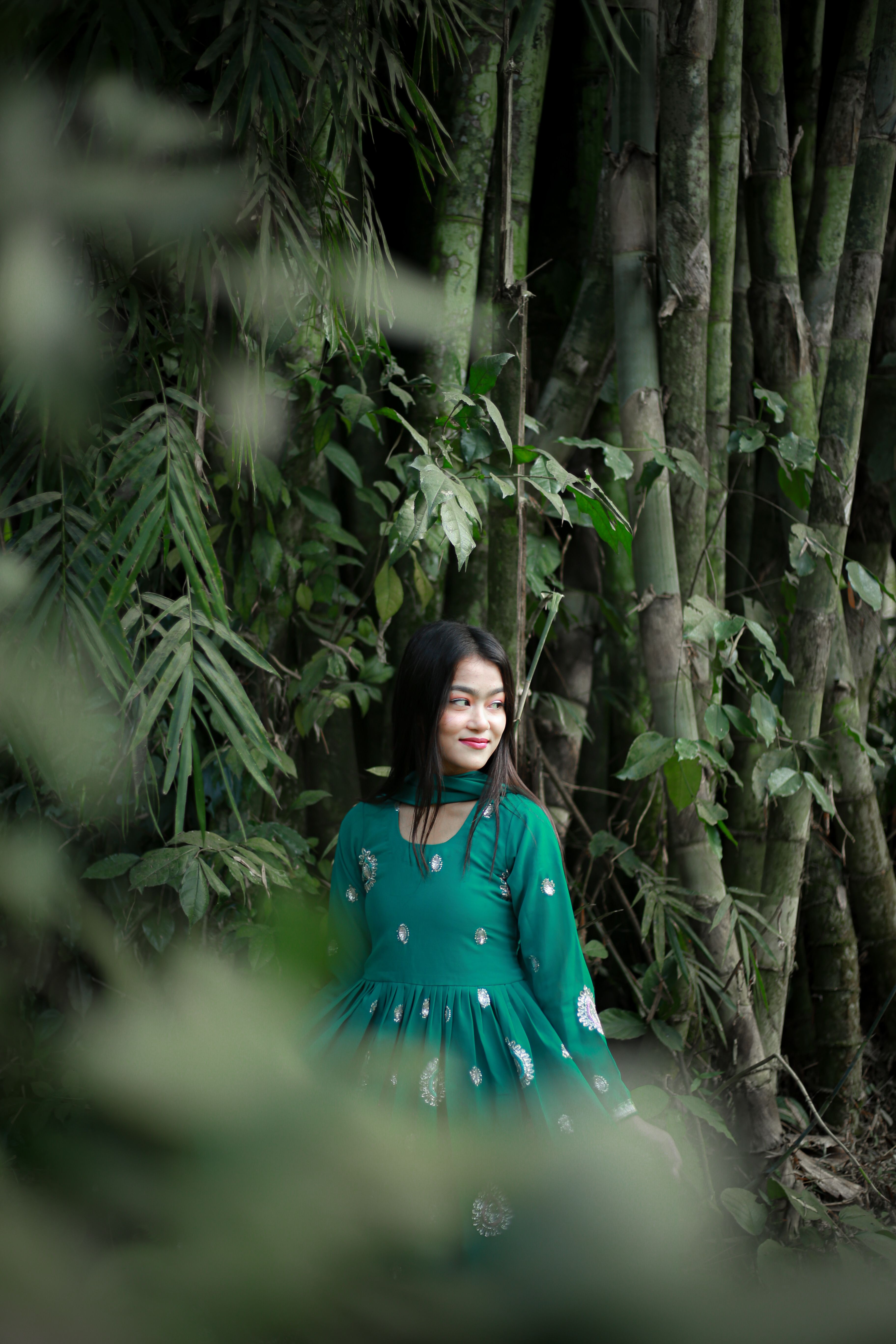 Woman in Green Dress Among Bamboo  Free Stock Photo