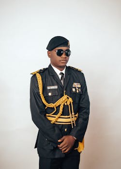 Portrait of a man in a detailed military uniform with medals, exuding authority.