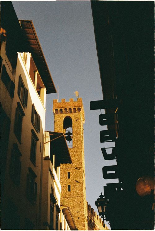 Free Medieval bell tower in Venice, Italy, against a clear sky. A blend of architectural heritage and modern streets. Stock Photo
