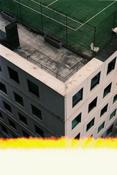 Bird's-eye view of a building's rooftop tennis court in Melbourne, Australia.