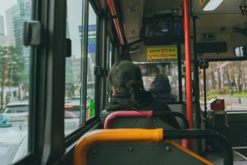 Free View from inside a Seoul city bus, capturing urban life and street scenes. Stock Photo