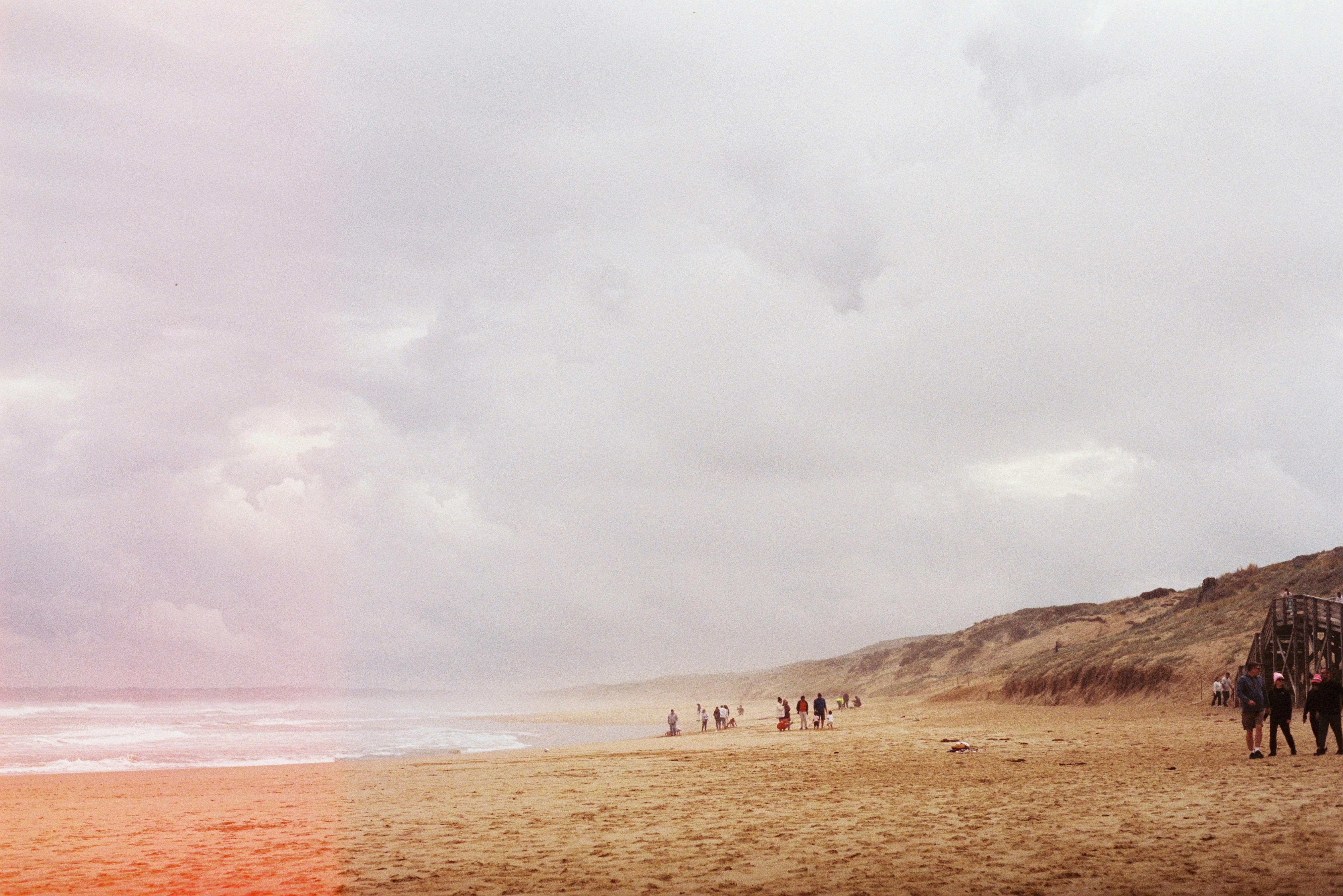 Capture of a serene beach at Cape Woolamai, Victoria with cloudy skies.