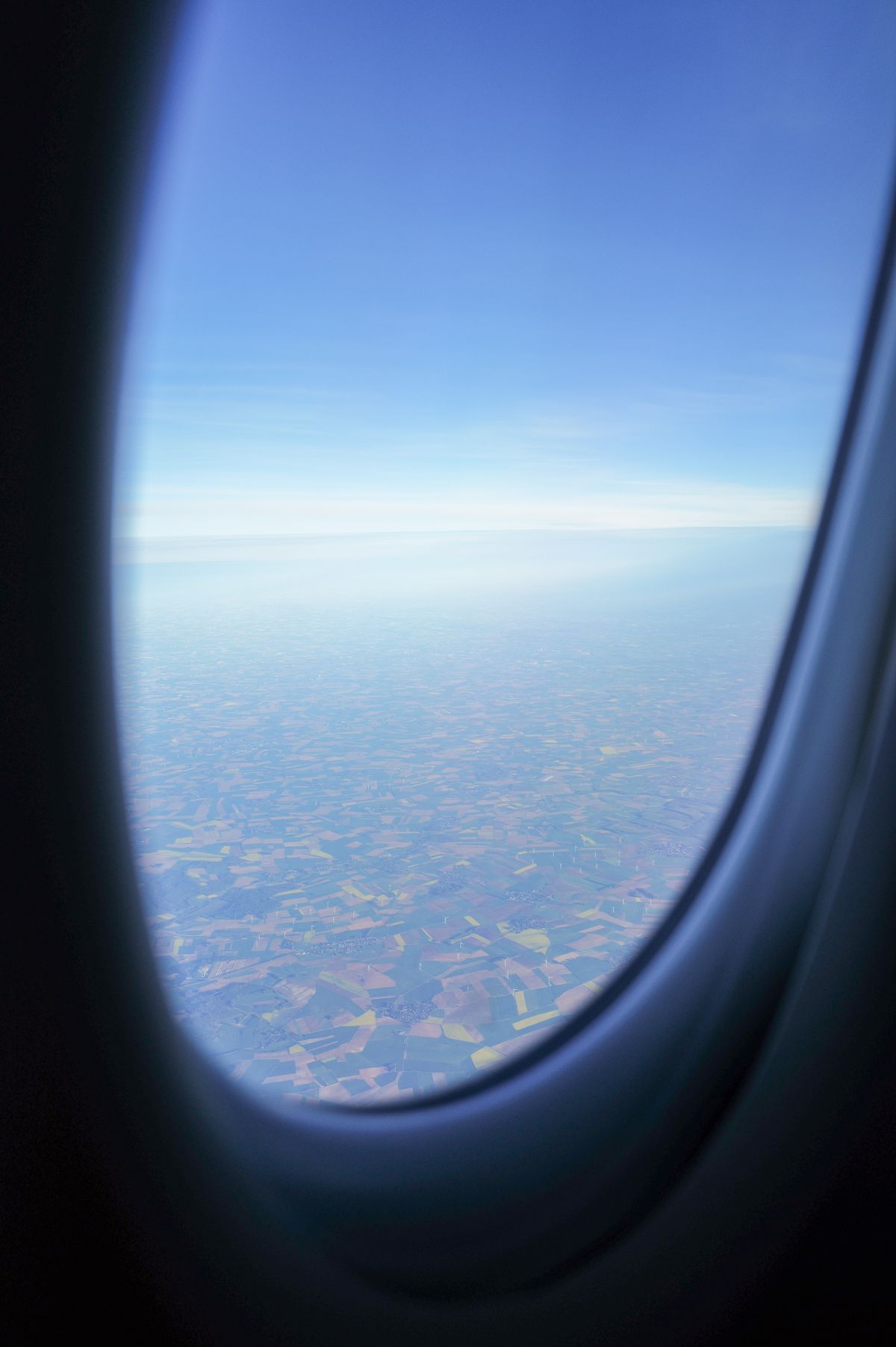 Scenic aerial landscape seen from an airplane window during flight