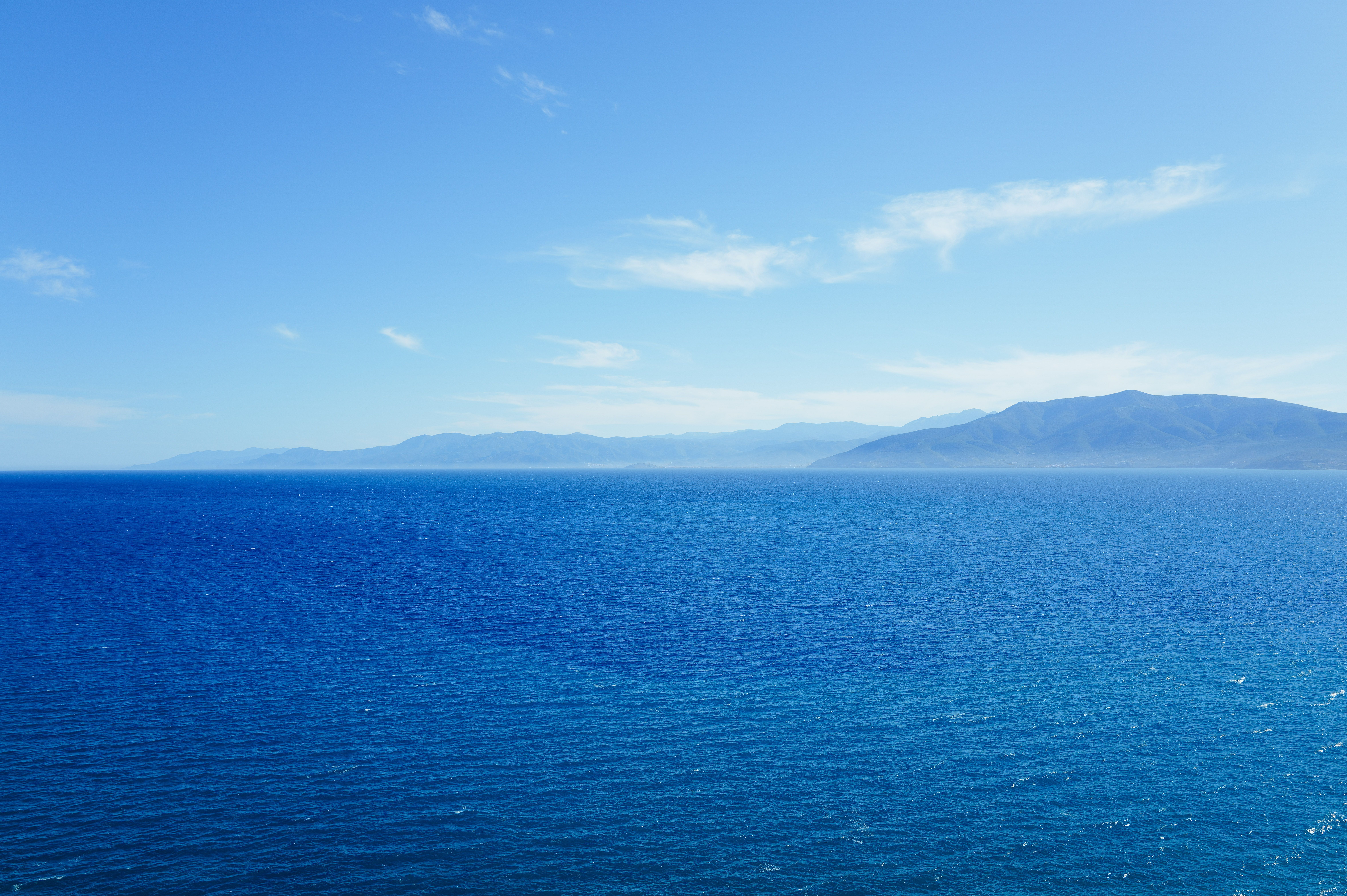 Serene Ocean View with Mountain Horizon