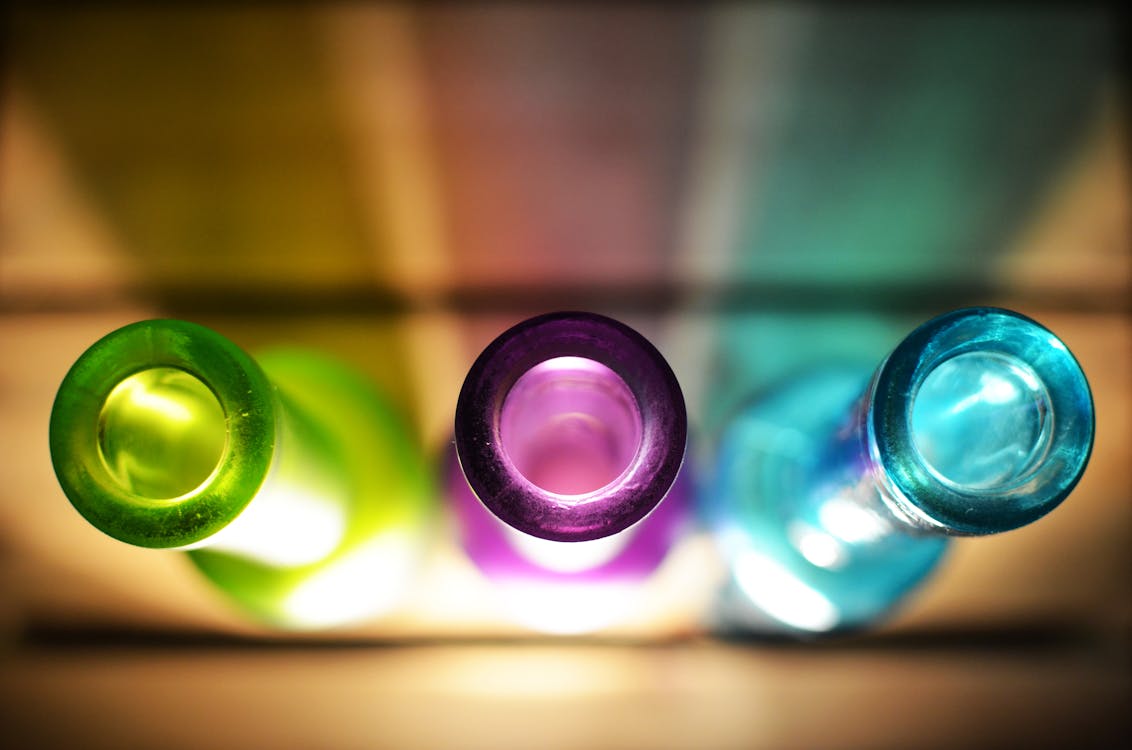 Free Purple, Green, and Blue Glass Bottles Stock Photo