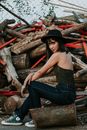 Woman Sitting on Wood Log