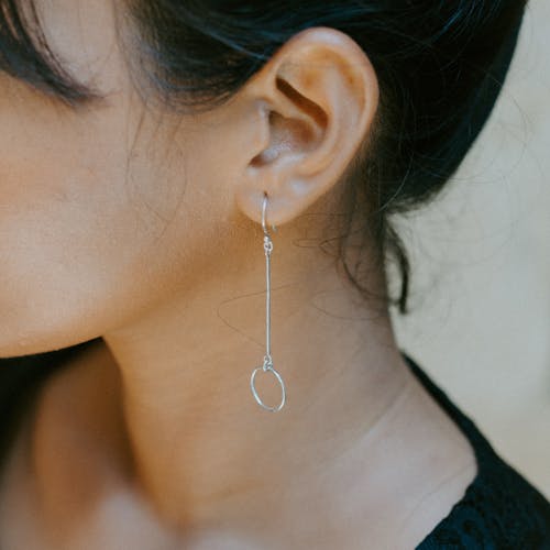 Free Woman Wearing Silver-colored Earring Stock Photo