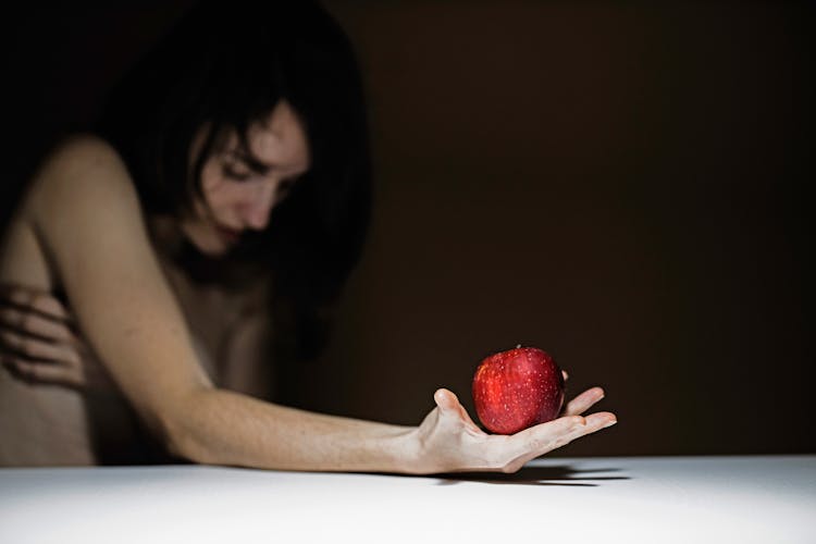 Woman Holding Red Apple