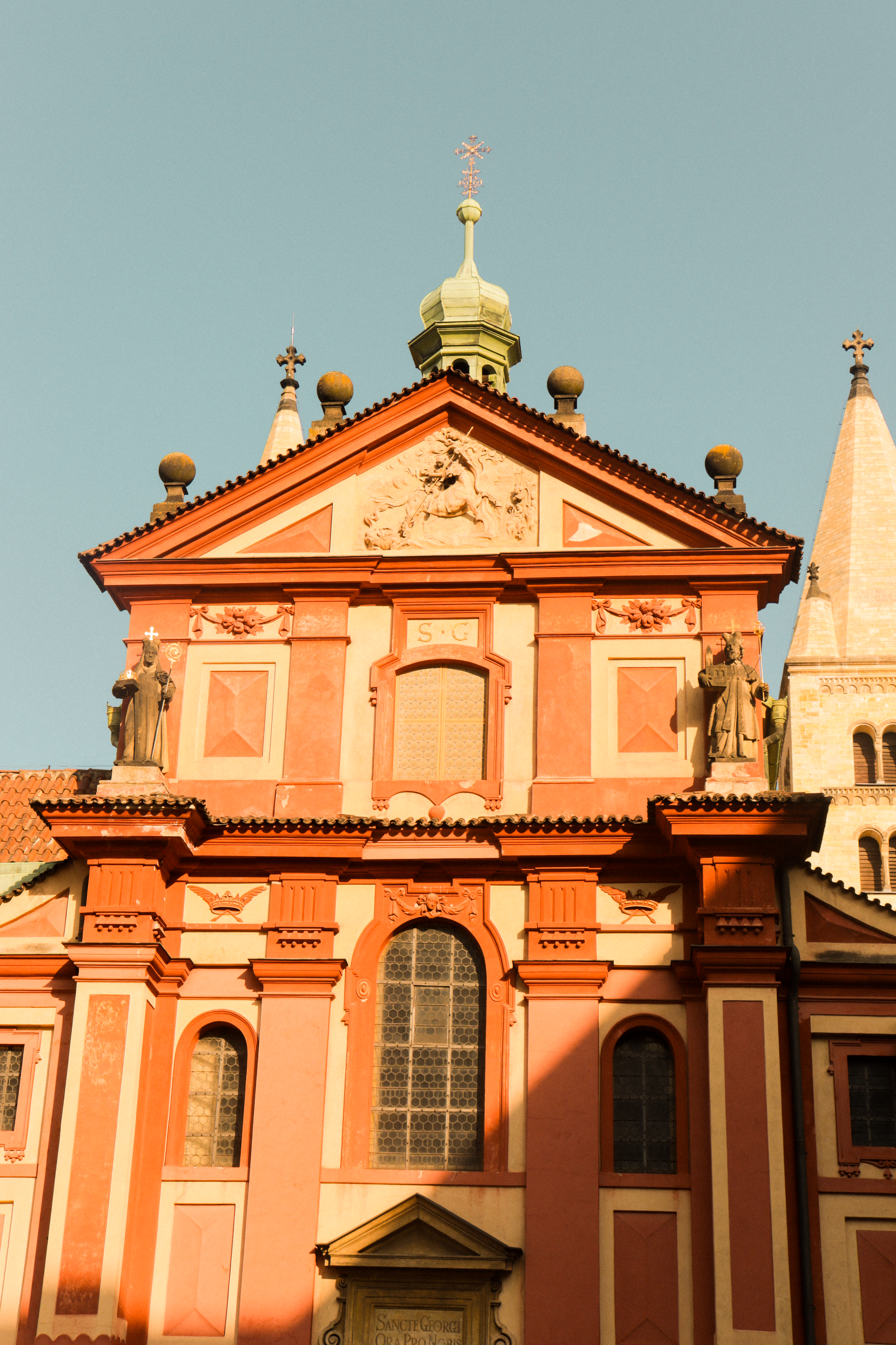 St. George's Basilica showcasing exquisite Romanesque architecture in Prague during sunset.